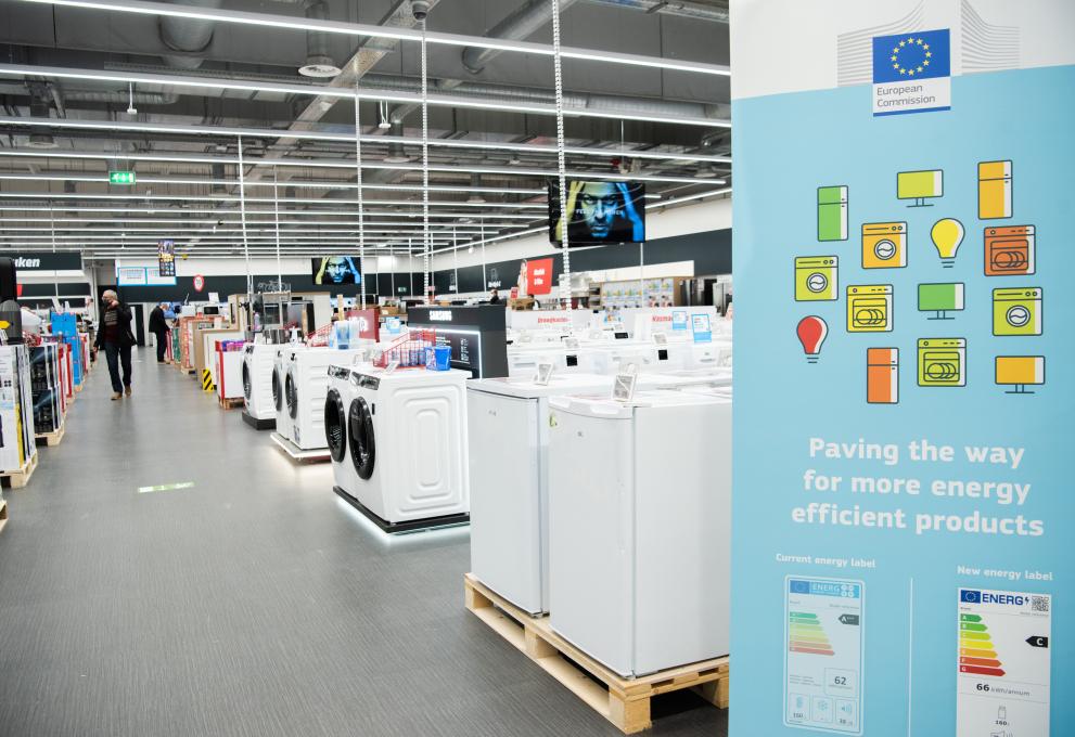 A poster in a home appliance store advertising the arrival of the new EU energy label