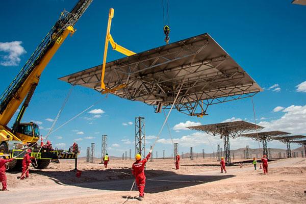 Men work at Cerro Dominador, the first thermosolar power plant in Latin America, in Antofagasta, Chile