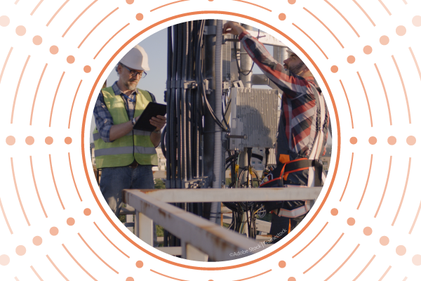 Two engineers working on a 5G antenna